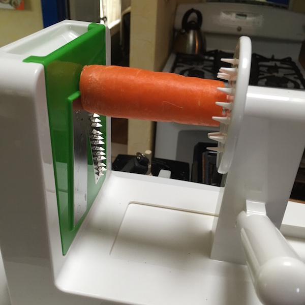 OXO spiralizer in action with the spaghetti cut blade #ad