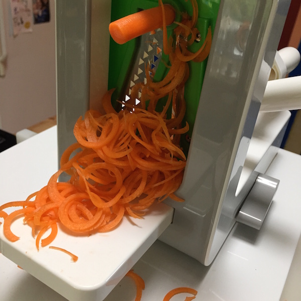 OXO spiralizer in action with the spaghetti cut blade #ad