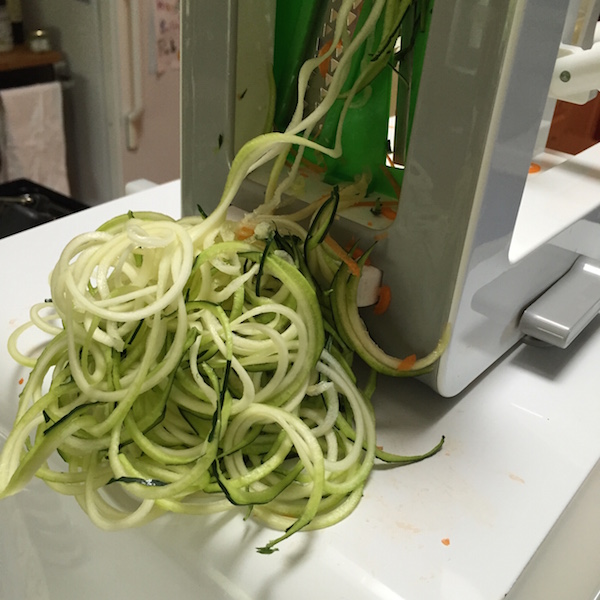 OXO spiralizer in action with the spaghetti cut blade #ad
